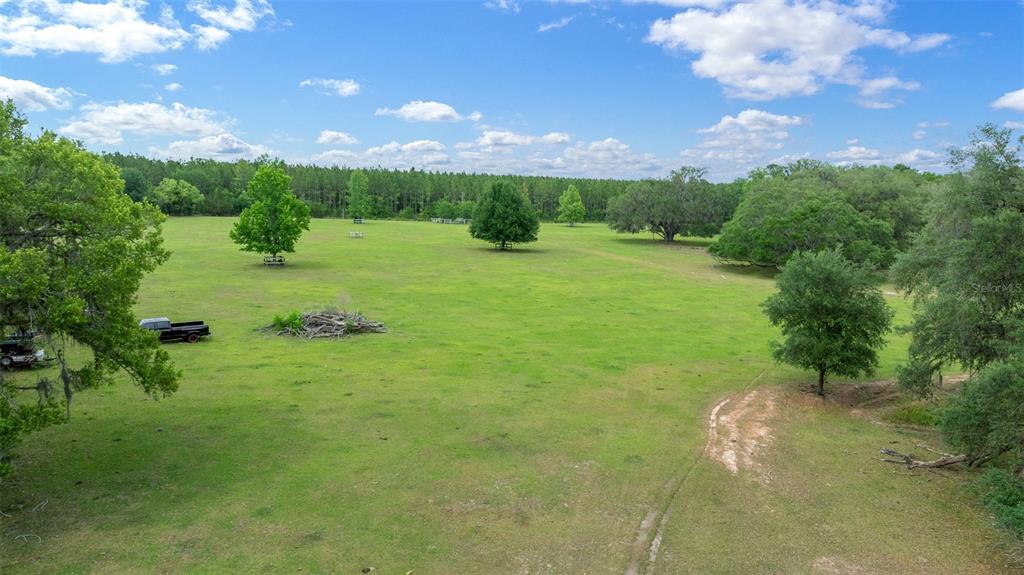 732 Carl Wilson Road Fort White, FL 32038 - Photo 66 of 80 a view of a golf course with a lake