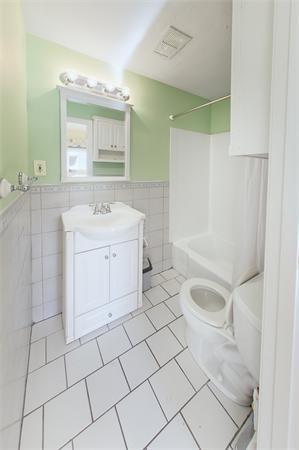 511 Beacon Street, Unit 12 Boston, MA 02215 - Photo 7 of 7 a spacious bathroom with a sink a toilet and mirror