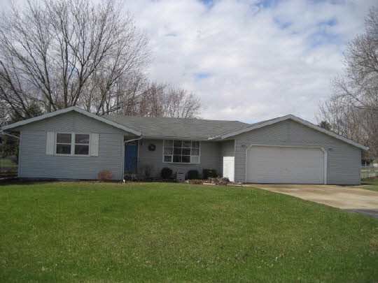 4075 Valerie Road Roscoe, IL 61073 - Photo 1 of 11 a front view of a house with a yard and garage