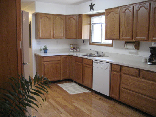 4075 Valerie Road Roscoe, IL 61073 - Photo 11 of 11 a kitchen with a sink window and cabinets