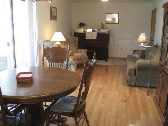 4075 Valerie Road Roscoe, IL 61073 - Photo 2 of 11 a dining room with furniture and wooden floor