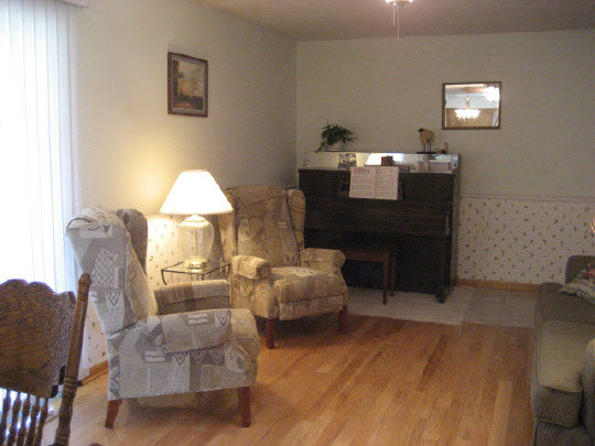 4075 Valerie Road Roscoe, IL 61073 - Photo 3 of 11 a living room with furniture and a fireplace