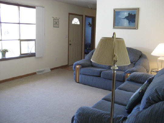 4075 Valerie Road Roscoe, IL 61073 - Photo 4 of 11 a living room with furniture and a window