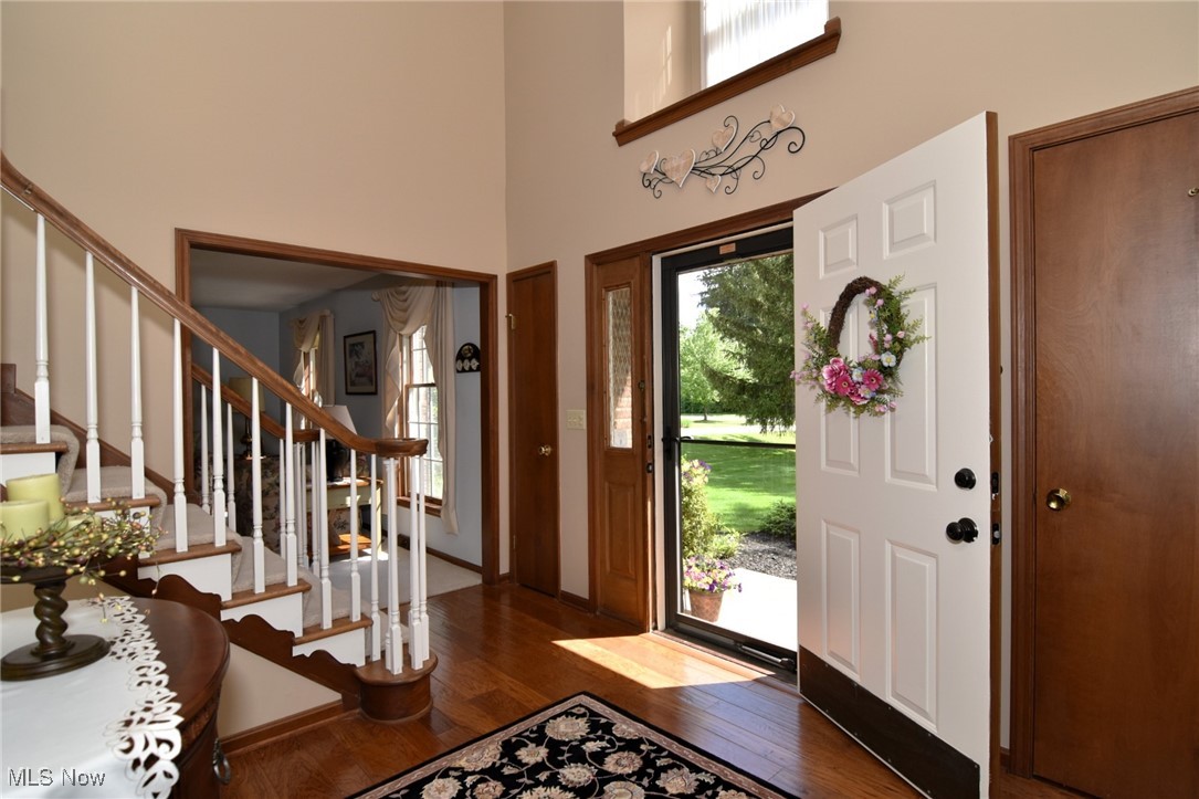 5510 Som Center Road Solon, OH 44139 - Photo 2 of 38 Entrance foyer featuring wood finished floors, a high ceiling, and stairs