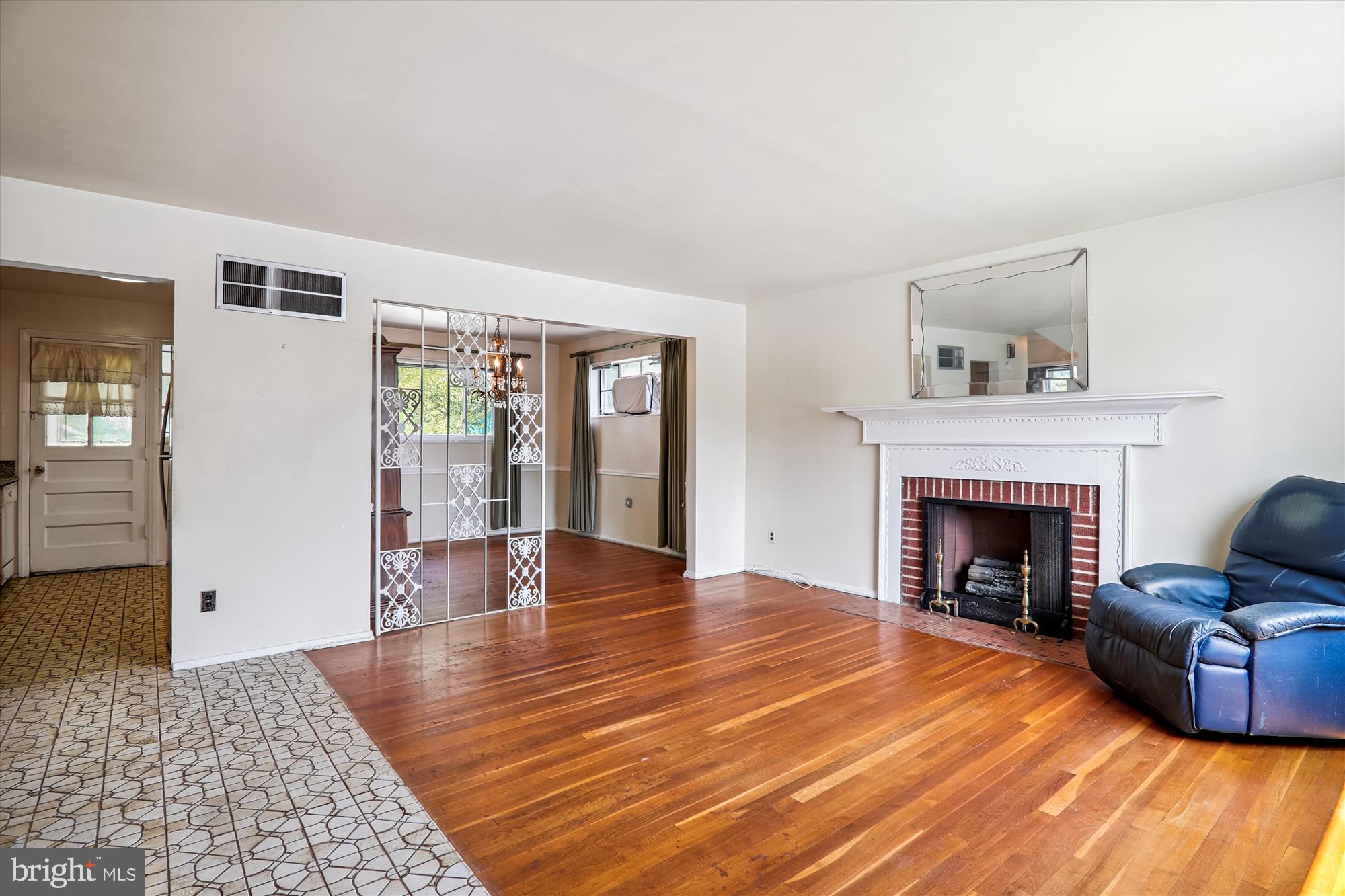 9507 Adelphi Road Silver Spring, MD 20903 - Photo 7 of 41 a living room with furniture and a fireplace