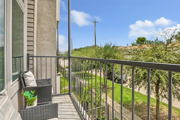 a view of balcony with furniture
