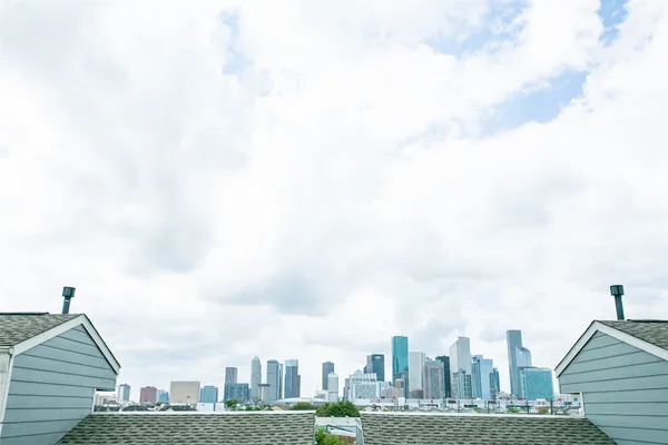 a view of a city with tall buildings in the background