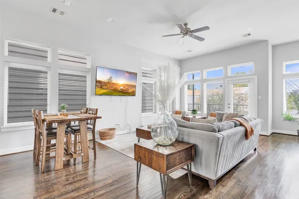 a living room with furniture and windows