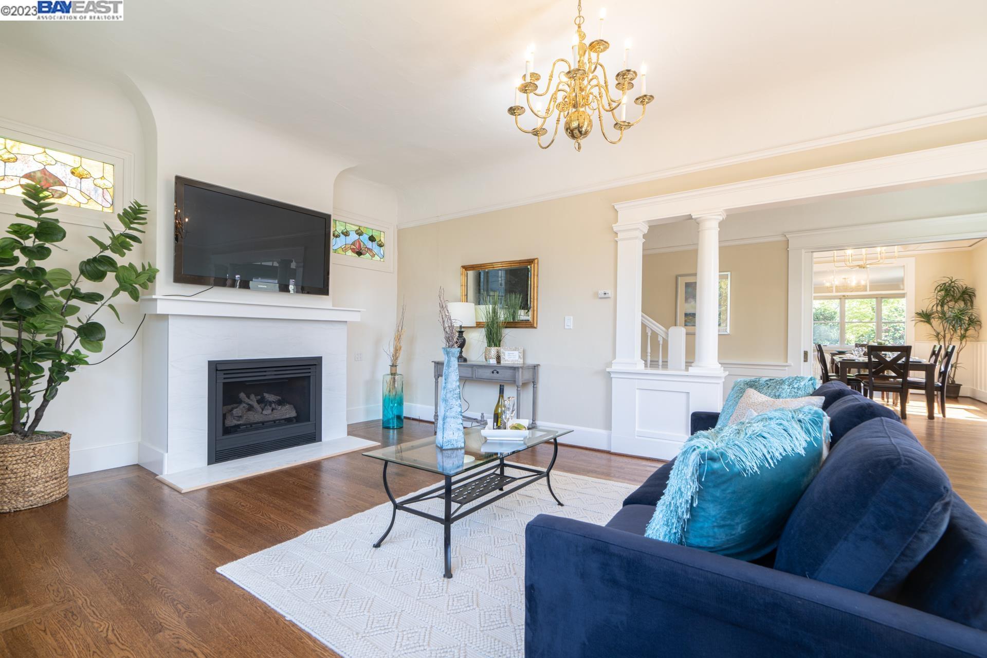 1336 Regent Street Alameda, CA 94501 - Photo 1 of 1 a living room with furniture a flat screen tv and a fireplace