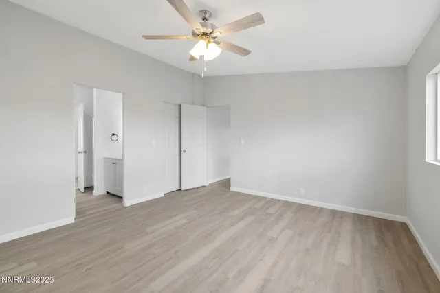 a bathroom with a sink a light fixture and a mirror