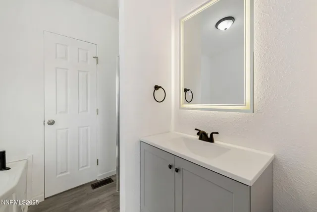 a room that has a mirror and a sink