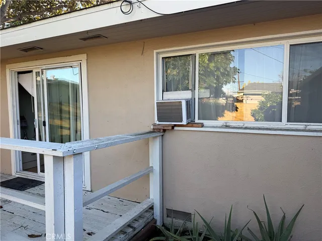 a living room with a couch and a table with wooden floor