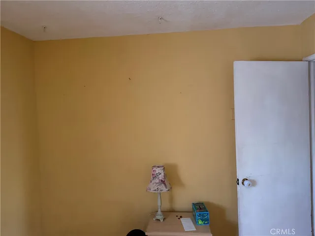 a view of a swimming pool with a patio and a garden