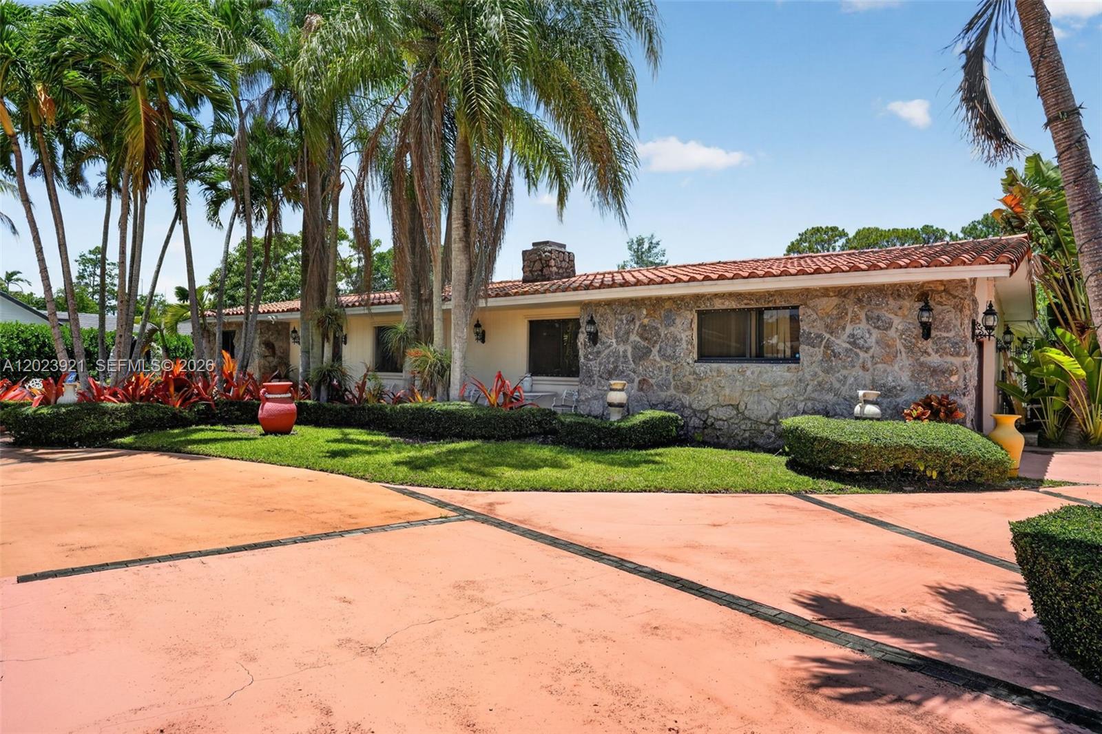 8461 Southwest 68th St Road Miami, FL 33143 - Photo 22 of 65 a view of a house with a yard and palm trees