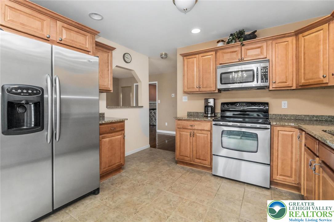 2132 Lexington Avenue Bethlehem, PA 18017 - Photo 15 of 47 a kitchen with stainless steel appliances cabinets and a refrigerator