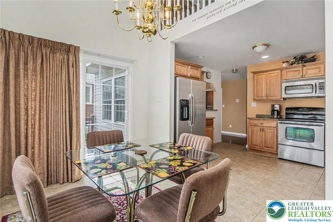 2132 Lexington Avenue Bethlehem, PA 18017 - Photo 18 of 47 a living room with furniture and a chandelier