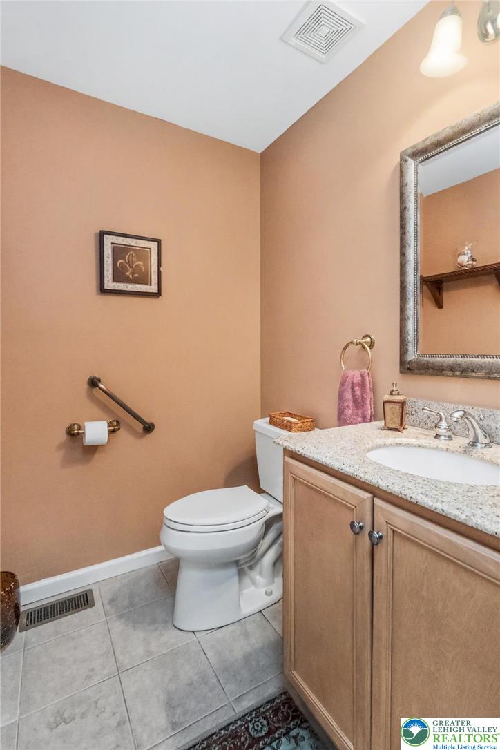 2132 Lexington Avenue Bethlehem, PA 18017 - Photo 21 of 47 a bathroom with a sink a toilet and mirror