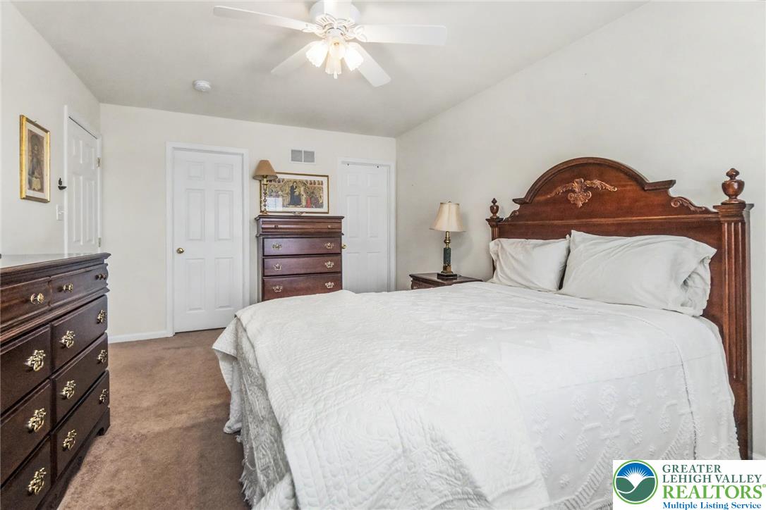 2132 Lexington Avenue Bethlehem, PA 18017 - Photo 22 of 47 a bedroom with a bed and a chandelier