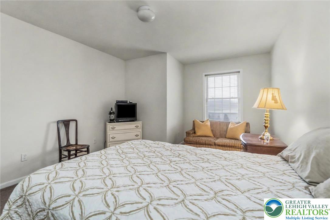 2132 Lexington Avenue Bethlehem, PA 18017 - Photo 29 of 47 a bedroom with a bed and a lamp on dresser