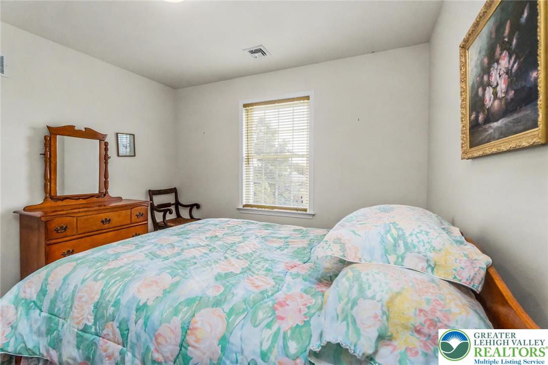 2132 Lexington Avenue Bethlehem, PA 18017 - Photo 31 of 47 a bedroom with a bed and a tv on the dresser