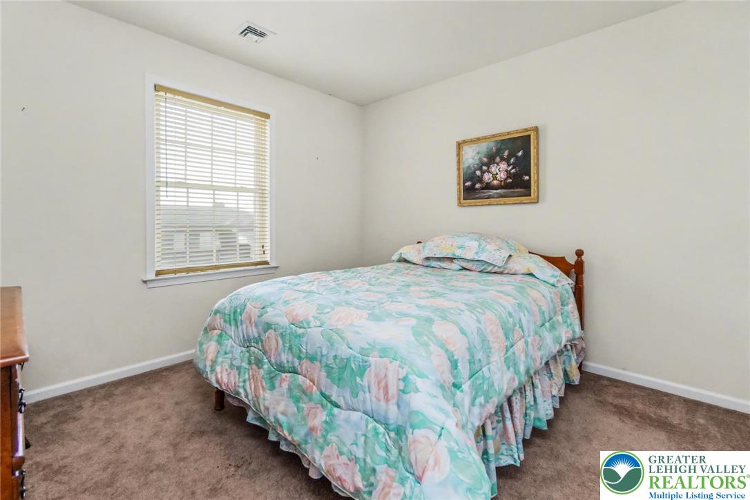 2132 Lexington Avenue Bethlehem, PA 18017 - Photo 33 of 47 a bedroom with a bed and a window