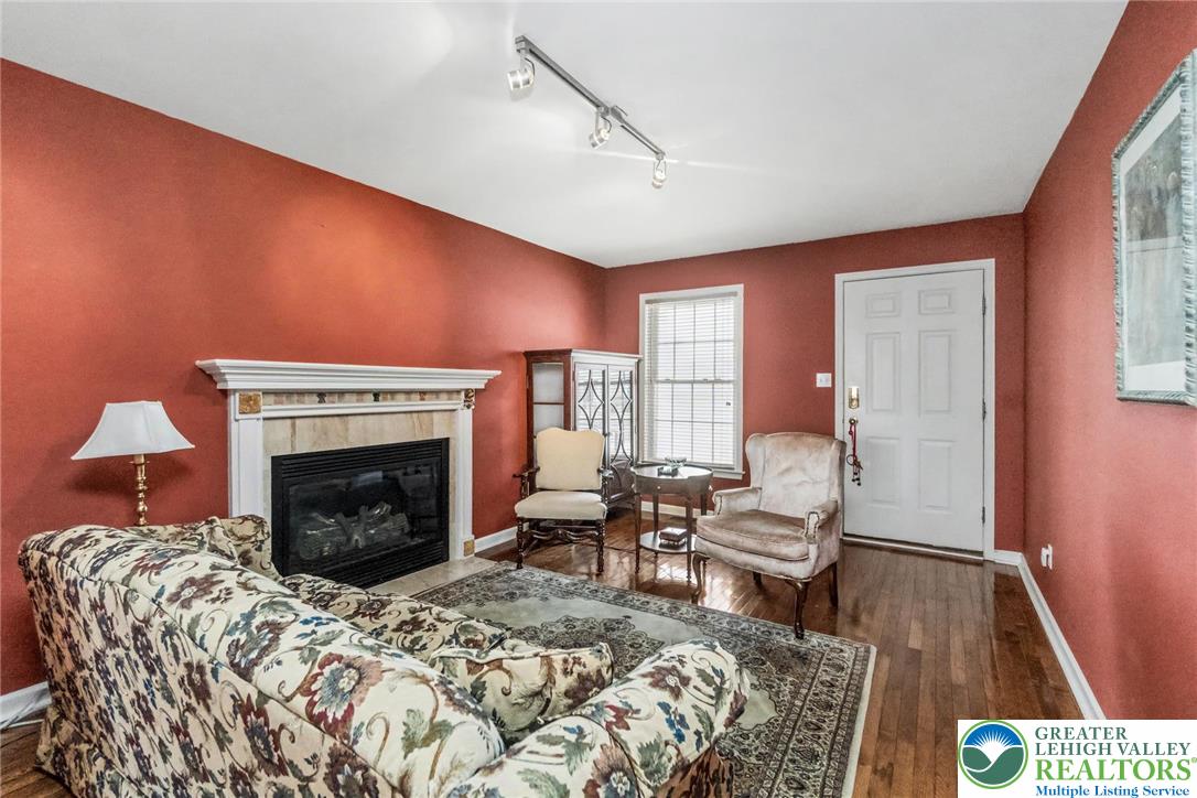2132 Lexington Avenue Bethlehem, PA 18017 - Photo 7 of 47 a bedroom with a bed and a fireplace