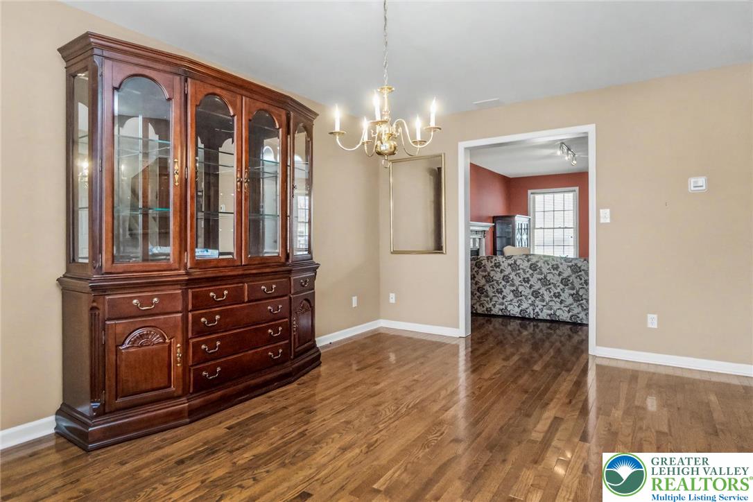 2132 Lexington Avenue Bethlehem, PA 18017 - Photo 10 of 47 a view of a hallway with wooden floor and cabinet