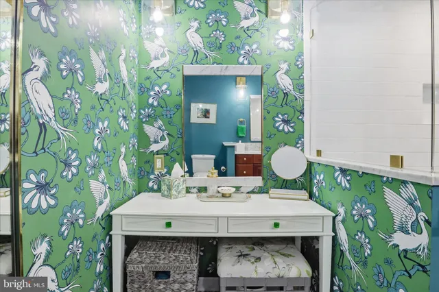 a bathroom with a sink a vanity and a mirror