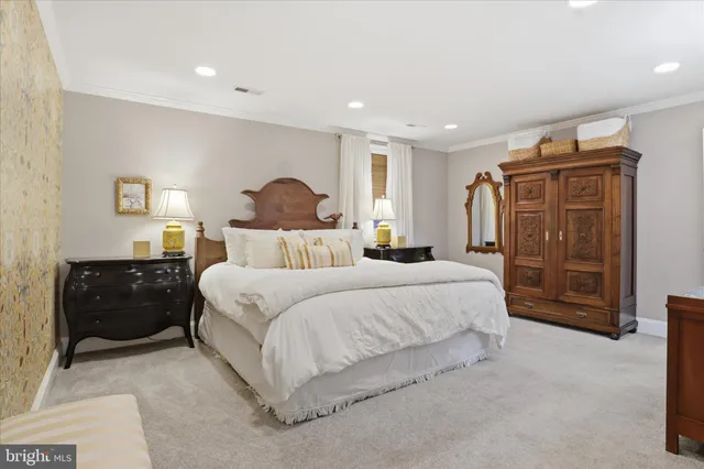 a bedroom with a bed and cabinets