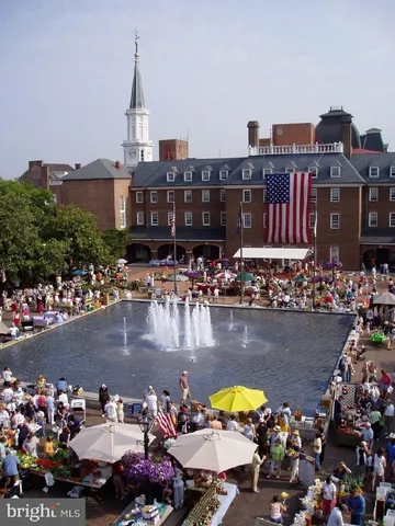 a view of a swimming pool with outdoor seating and yard