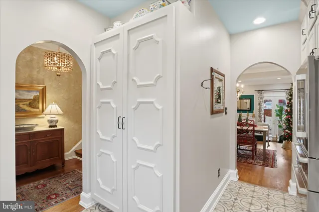a kitchen with stainless steel appliances granite countertop a sink a stove and cabinets