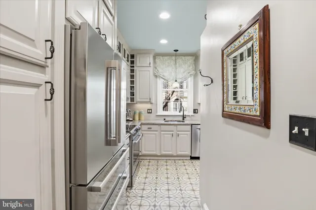 a bathroom with a granite countertop sink a mirror a bathtub and shower