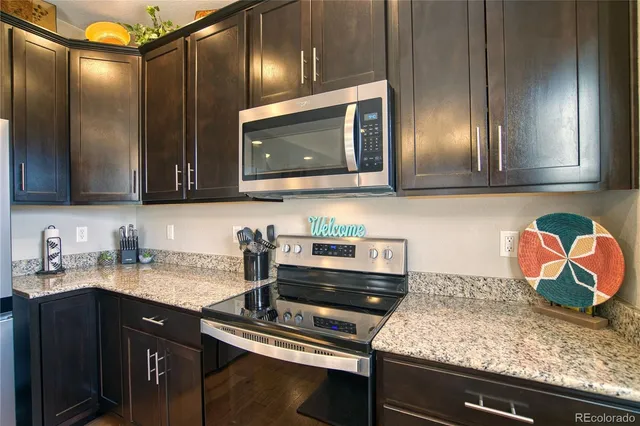 a kitchen with sink cabinets and microwave