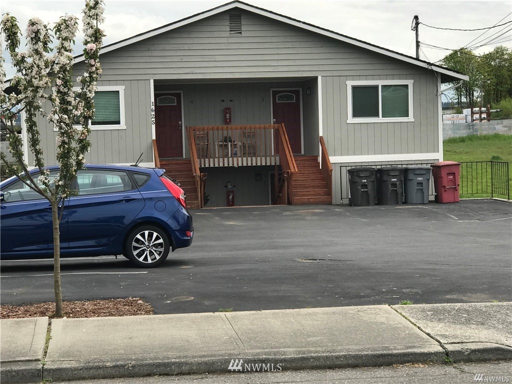 a front view of a house with garage