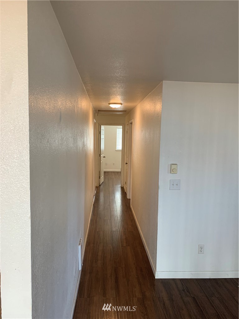 1625 Chestnut Street Everett, WA 98201 - Photo 13 of 27 a view of a hallway with wooden floor