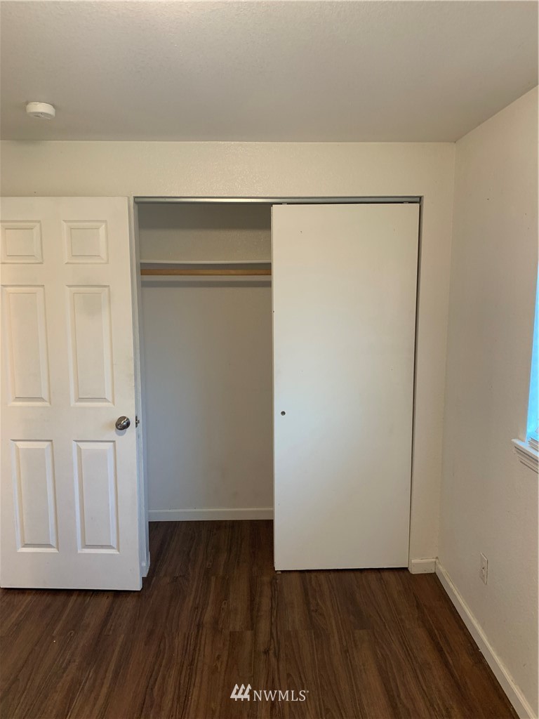 1625 Chestnut Street Everett, WA 98201 - Photo 20 of 27 an empty room with wooden floor and closet
