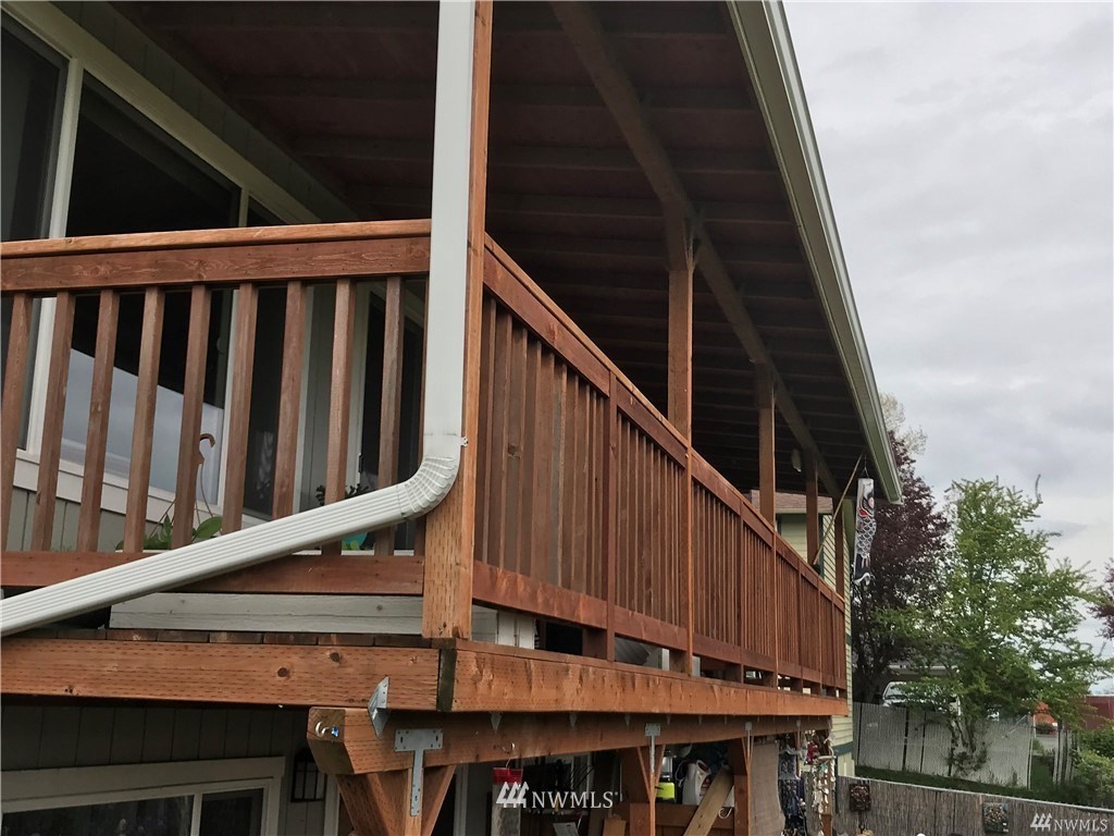 1625 Chestnut Street Everett, WA 98201 - Photo 5 of 27 a roof deck with wooden floor and fence
