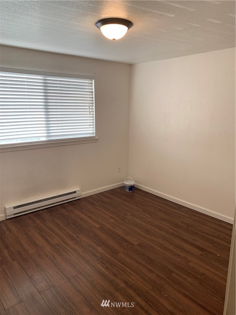 1625 Chestnut Street Everett, WA 98201 - Photo 9 of 27 an empty room with wooden floor and windows