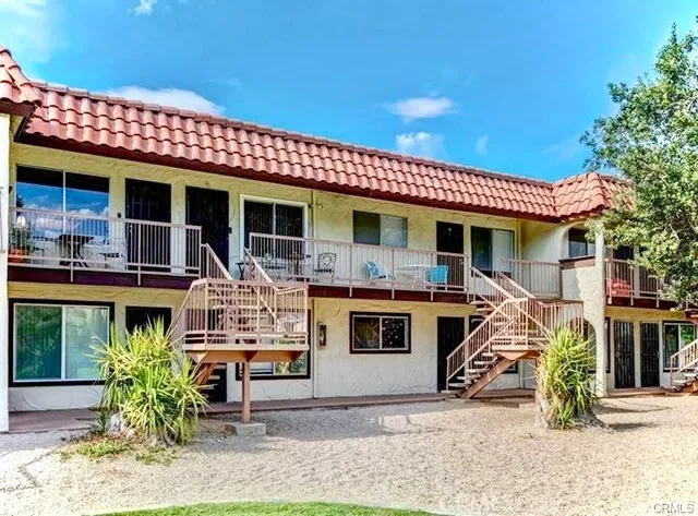 a view of a park with large trees