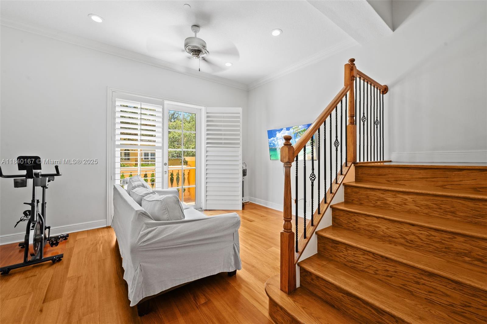 400 Northeast 69th Circle Boca Raton, FL 33487 - Photo 11 of 35 a living room with wooden floor and a dining table