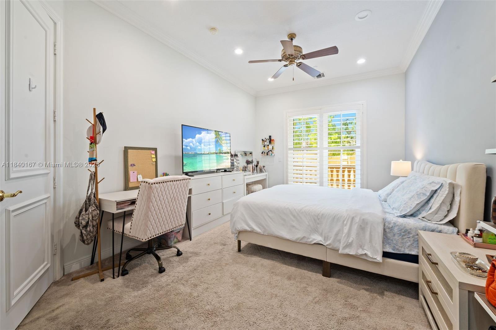 400 Northeast 69th Circle Boca Raton, FL 33487 - Photo 22 of 35 a bedroom with a bed workspace and a window