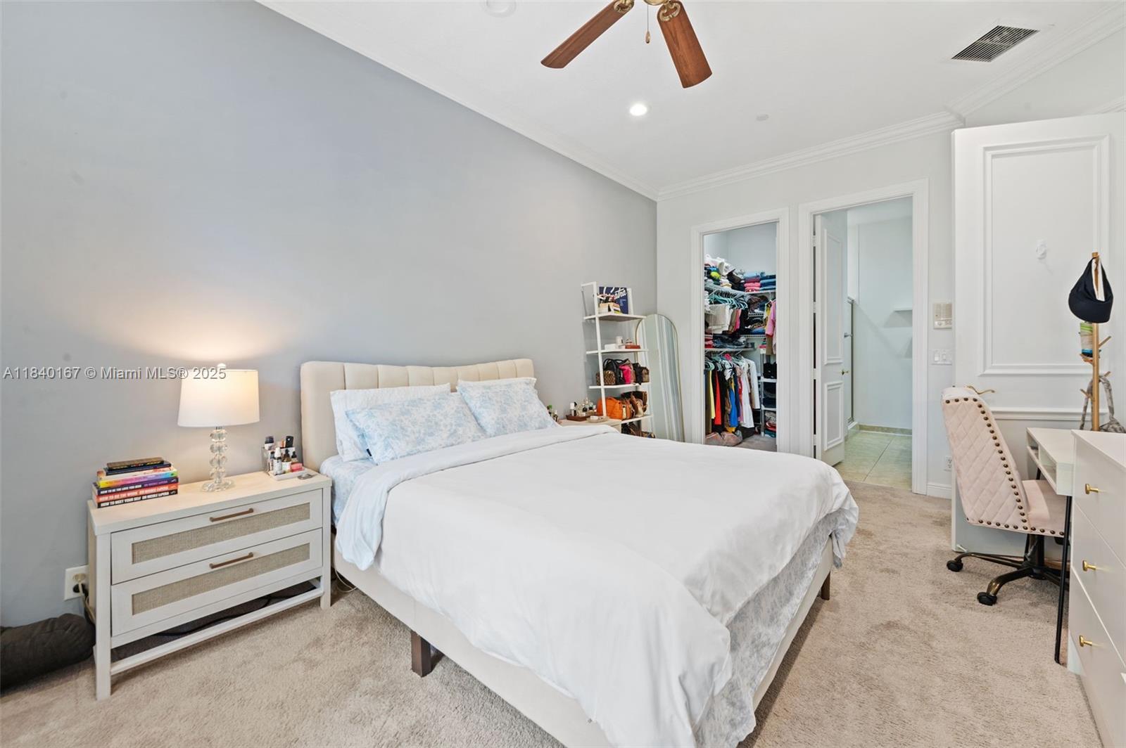 400 Northeast 69th Circle Boca Raton, FL 33487 - Photo 23 of 35 a bed room with a bed and a desk