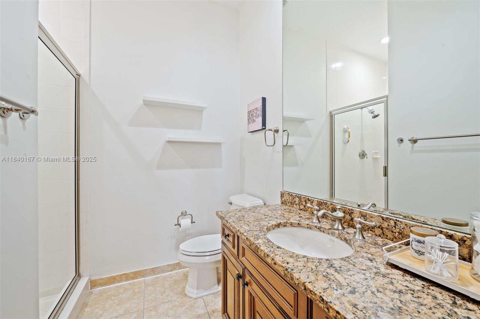 400 Northeast 69th Circle Boca Raton, FL 33487 - Photo 25 of 35 a bathroom with a granite countertop sink toilet a mirror and shower