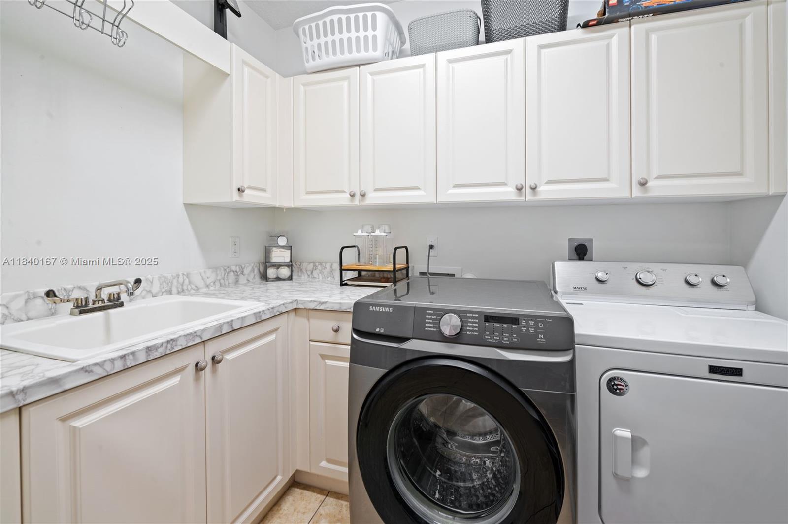 400 Northeast 69th Circle Boca Raton, FL 33487 - Photo 26 of 35 a utility room with sink dryer and washer