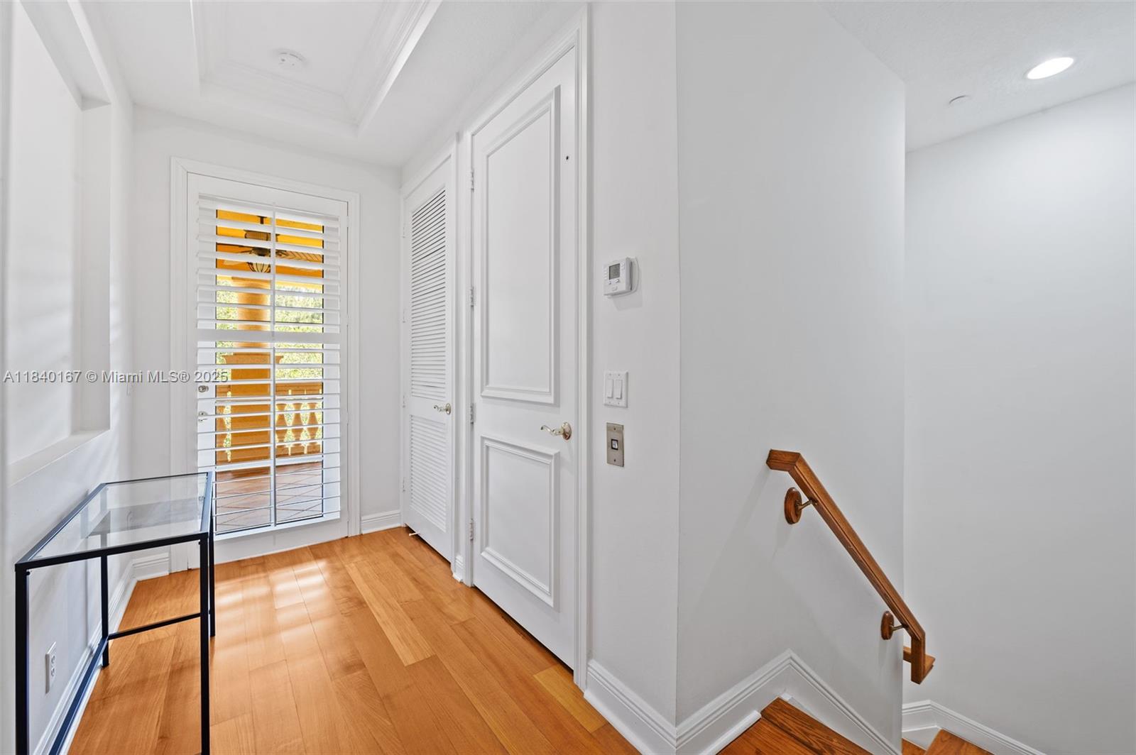 400 Northeast 69th Circle Boca Raton, FL 33487 - Photo 27 of 35 a view of an empty room with wooden floor and a window