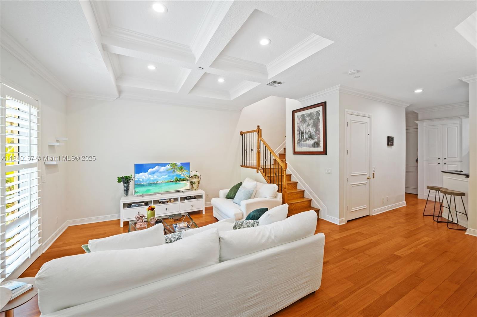 400 Northeast 69th Circle Boca Raton, FL 33487 - Photo 4 of 35 a living room with furniture and a flat screen tv