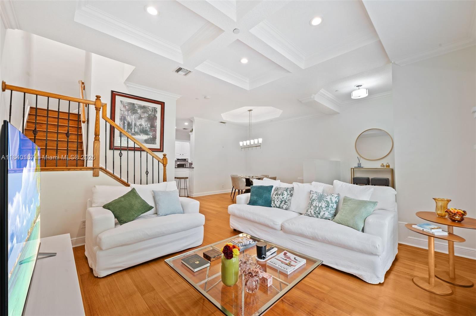 400 Northeast 69th Circle Boca Raton, FL 33487 - Photo 5 of 35 a living room with furniture and wooden floor