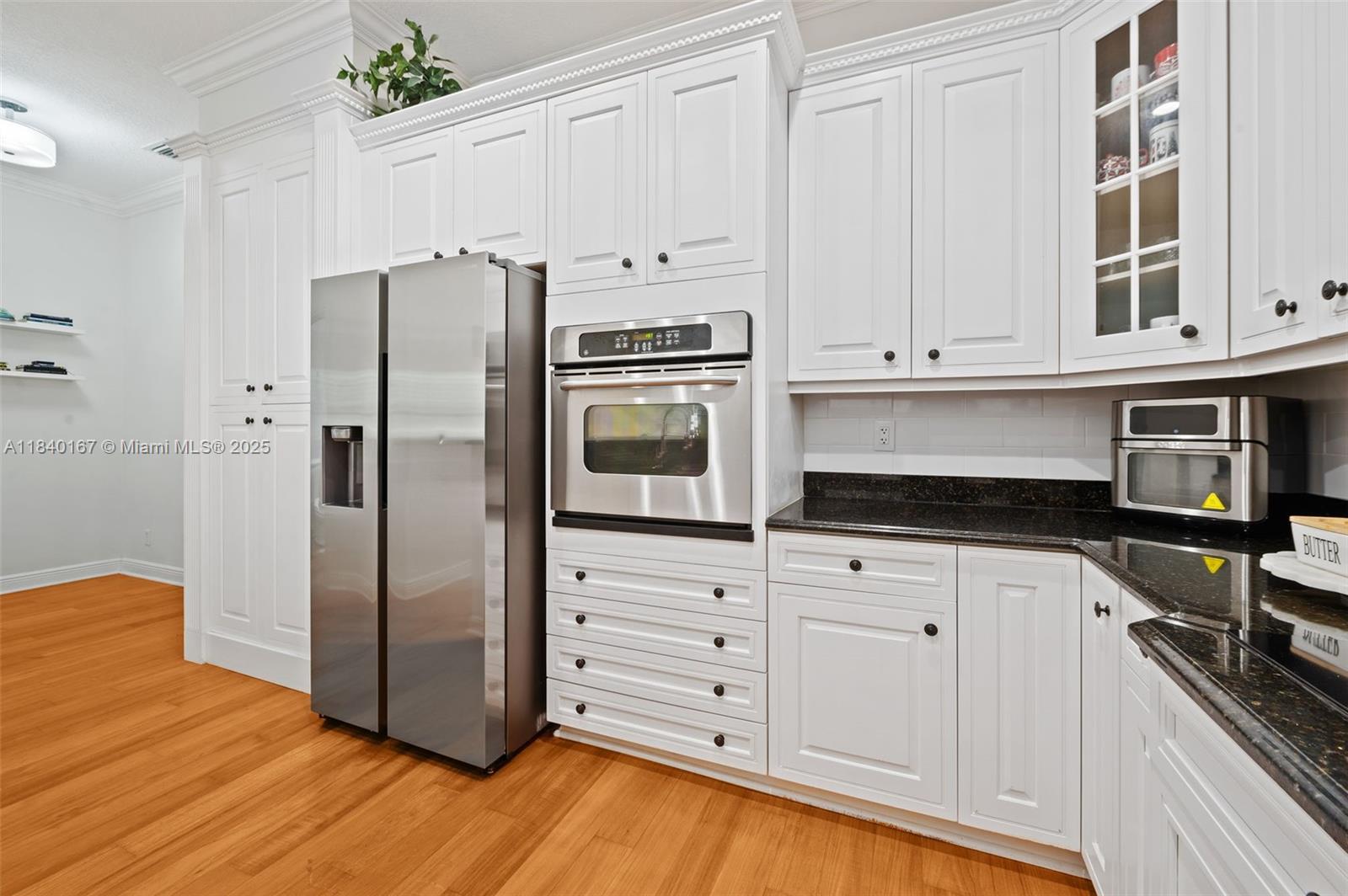 400 Northeast 69th Circle Boca Raton, FL 33487 - Photo 7 of 35 a kitchen with appliances cabinets and a counter top space