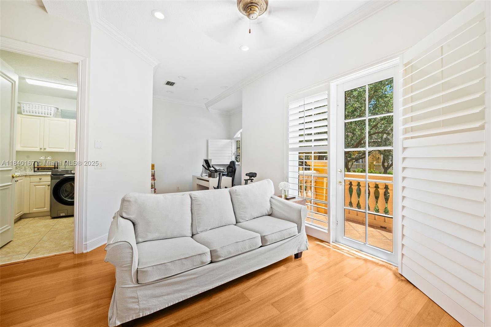 400 Northeast 69th Circle Boca Raton, FL 33487 - Photo 10 of 35 a living room with furniture and a large window