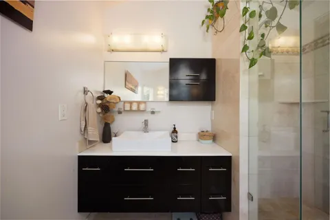 a bathroom with a sink and a mirror